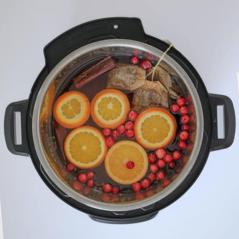 tea and garnishes added to juice in the instant pot.